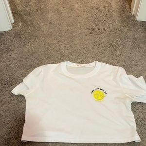 White loose crop top.“When life gives you lemons”